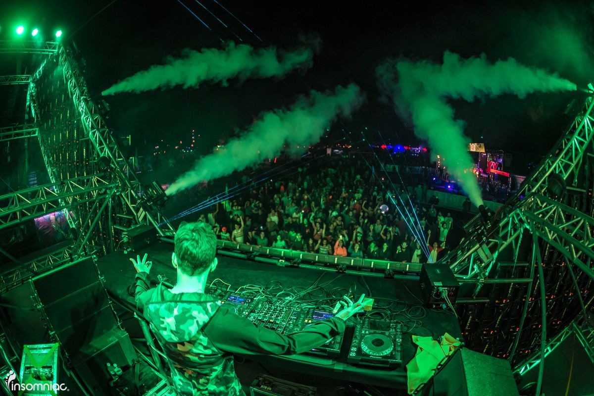 CHASER at the decks with green lasers at EDC México