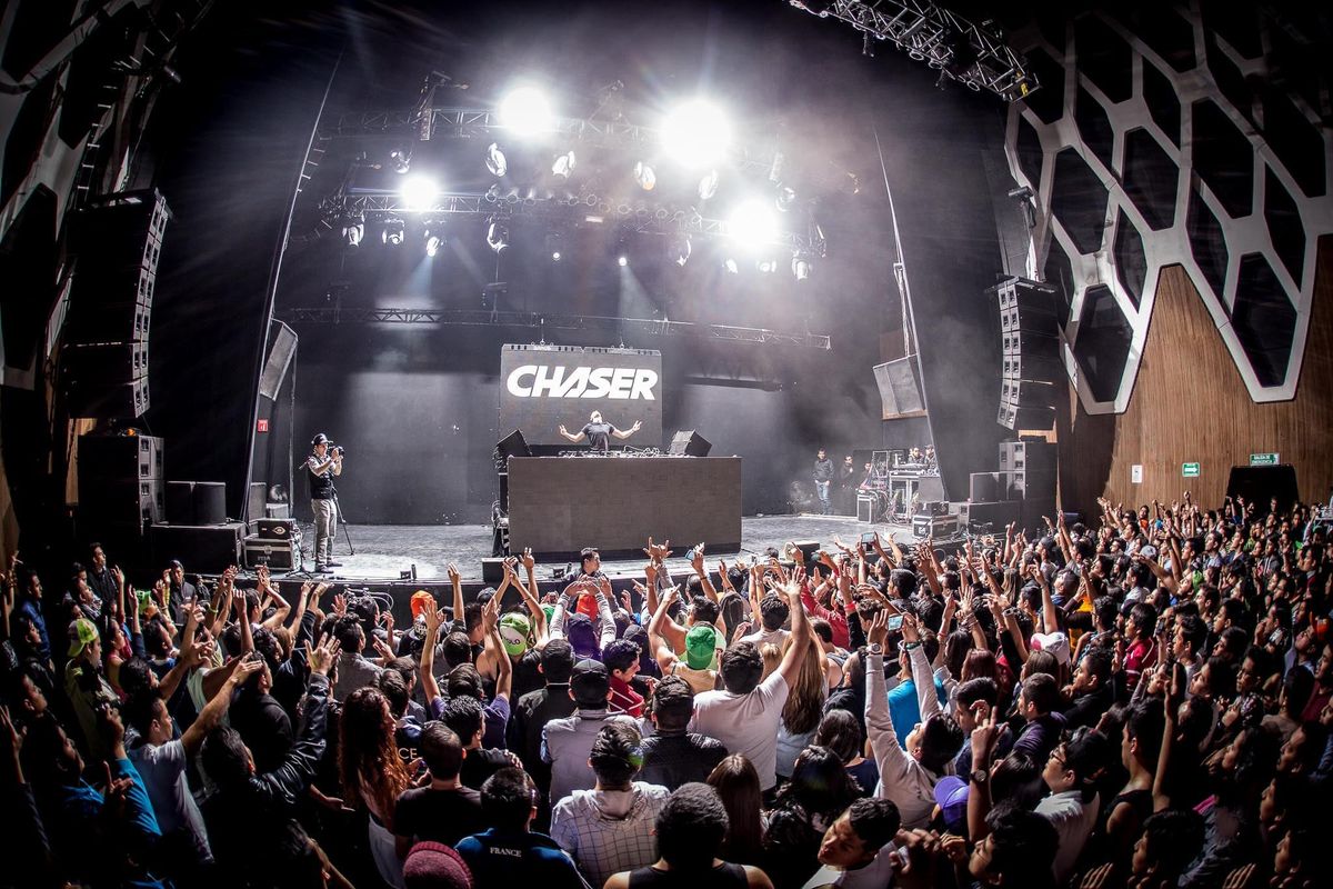 CHASER on stage in front of a packed venue